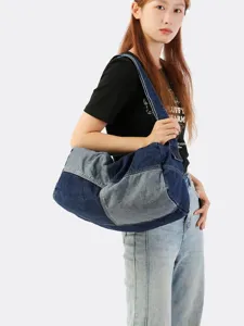 Large distressed washed denim patchwork shoulder travel bag for casual use