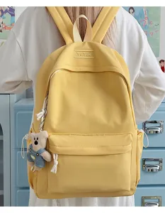 Sac à dos jaune pour étudiant avec charme d'ours mignon porté pour l'école au quotidien.