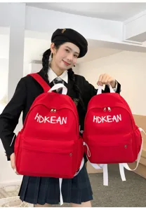 Sac à dos scolaire rouge pour filles avec broderie HDKEAN en deux dimensions.