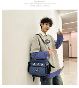 Blue tooling style messenger bag shown on a model for casual commute
