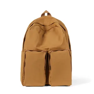 Detailed view of brown casual backpack featuring two prominent front zipper pockets.