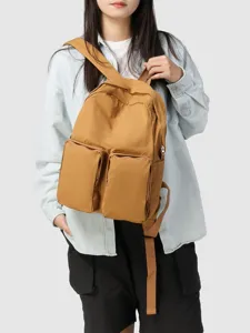 Large capacity ginger yellow backpack with dual front pockets for school and casual use