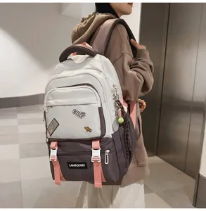 Stylish color-block school backpack for girls with cute patches and pink straps