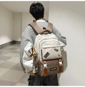 Stylish campus student backpack featuring a color-contrast design and decorative patches.