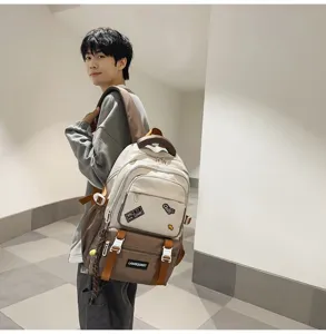 Stylish color-block school backpack with patches shown in use by a student