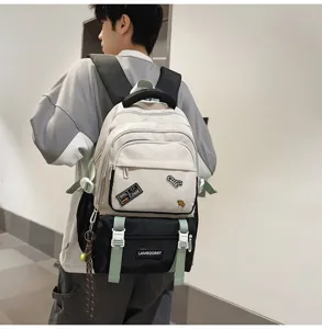 Close-up detail of color-contrast schoolbag worn by model in a minimalist hallway