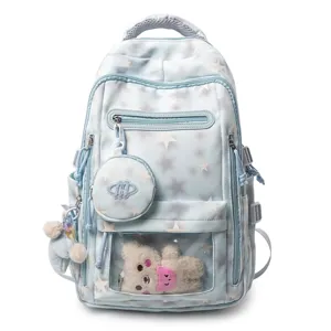 Zaino scolastico azzurro con stelle, orsetto di peluche e mini pochette accessorio.