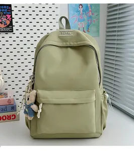 Sac à dos d'étudiant minimaliste couleur bonbon avec un charm d'ours mignon en décor