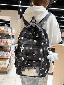 Zaino scolastico nero capiente con stampa a stelle bianche e ciondolo di peluche