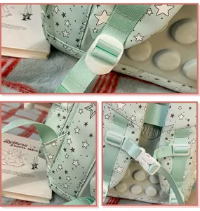 Mint green star print student school backpack with decompression bubble design and adjustable straps.