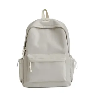 Vue détaillée de face d'un sac à dos beige minimaliste à grande capacité pour l'école