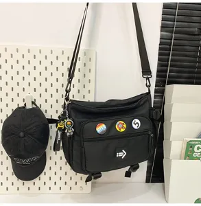 Korean style large capacity black canvas messenger bag for students with cute badges