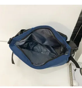 Detail view of the spacious blue messenger bag interior with smooth zipper opening