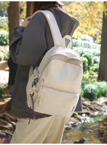 Sac à dos à carreaux crème élégant pour étudiants, grande capacité, style de vie en plein air.