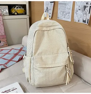 Sac à dos à carreaux crème pour étudiants avec grande capacité et pompons