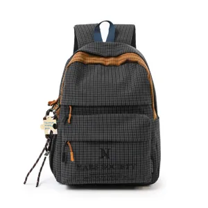 Sac à dos à carreaux noir grande capacité pour étudiants avec pendentif décoratif