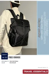 Detailed view of a black roll-top commuter backpack worn by a model in a studio setting.