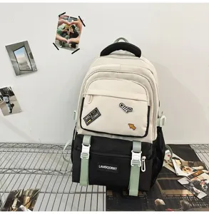 Stylish color-block student backpack for school featuring cute patches and mint green straps