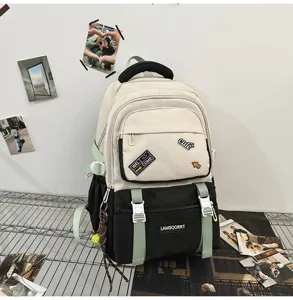Stylish color-block student backpack with patches and mint green straps detail