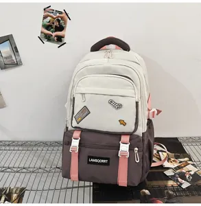 Detail of stylish two-tone campus school backpack with cute patches and pink straps