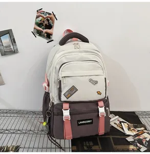 Detail view of stylish color-blocked student backpack with cute decorative patches