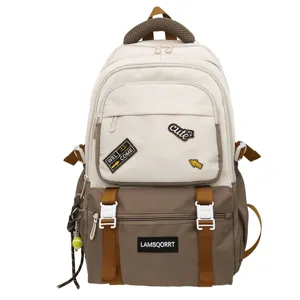 Detail view of the stylish color-block backpack with decorative patches and pockets