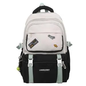 Detailed view of color-contrast student backpack featuring cute patches and durable straps