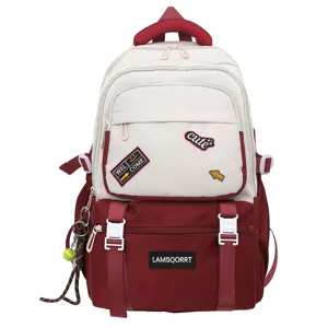 Two-tone school backpack for students featuring stylish patches in cream and burgundy colors