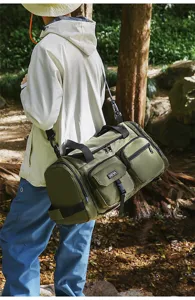 Outdoor lifestyle view of olive green large capacity gym bag with multiple pockets