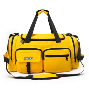 Detailed view of the vibrant yellow multi-pocket sports fitness duffel bag with black straps.