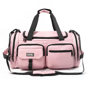 Front detail of pink sports fitness bag with multiple pockets and dry-wet separation design