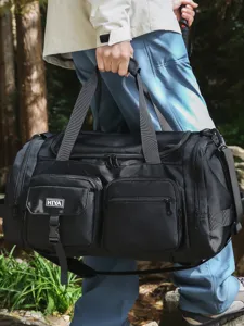 Large capacity black multi-pocket gym bag for outdoor travel and fitness sports.
