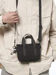 Minimalist black mini crossbody tote bag for women with adjustable shoulder strap for daily use