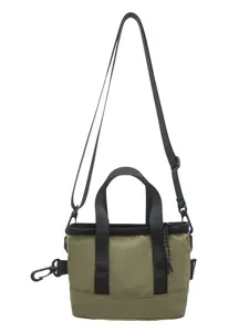 Minimalist olive green nylon crossbody tote bag featuring black handles and straps