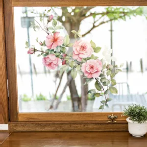 Macro detail of delicate pink rose floral static cling window sticker on glass pane