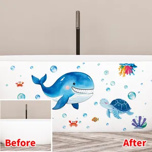 Detail of ocean whale and turtle waterproof stickers applied on a white bathtub