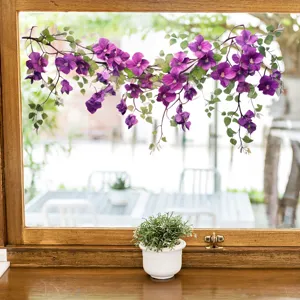 Macro detail of elegant purple flower vine window decal with vibrant green leaves