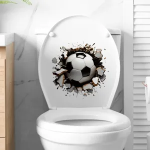 3D visual effect soccer ball breaking through the surface sticker on a white toilet lid