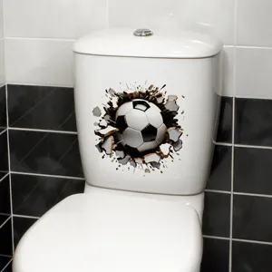 Detail view of 3D broken wall soccer ball toilet sticker on white bathroom tank