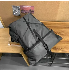 Modern dark grey men's business roll-top backpack for daily commute and casual travel