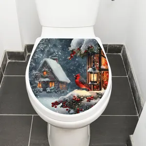 Detail view of a waterproof Christmas snow house toilet sticker applied on a white seat.