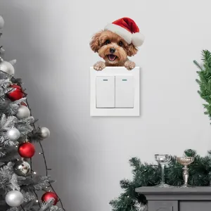Adesivo murale cucciolo di Natale con cappello di Babbo Natale su interruttore luce casa