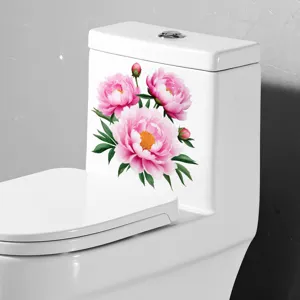 Pink peony flower sticker applied to a white ceramic toilet tank for bathroom decor.