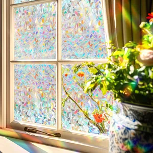 Detail view of PVC rainbow window film creating vibrant sun catcher light effects