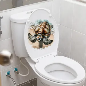 Realistic sea turtle beach decal applied to a modern white toilet lid in a clean bathroom.