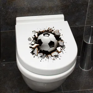 Macro view of a creative 3D soccer ball wall sticker on a white ceramic toilet lid