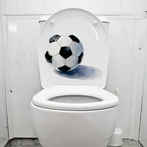 Detailed view of a watercolor football sticker applied to a white toilet lid for bathroom decor