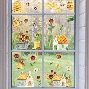 Détail d'autocollants statiques aquarelle tournesol et abeille posés sur une vitre claire