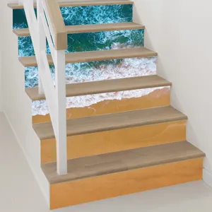 Interior detail of decorative 3D beach wave staircase stickers on wooden stairs