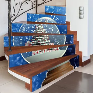 Detailed view of 3D Christmas snow globe stair stickers on a wooden staircase riser
